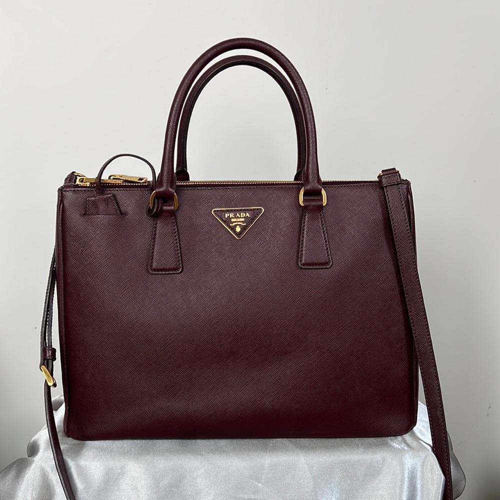 Authentic Prada Galleria Saffiano leather large bag in maroon.